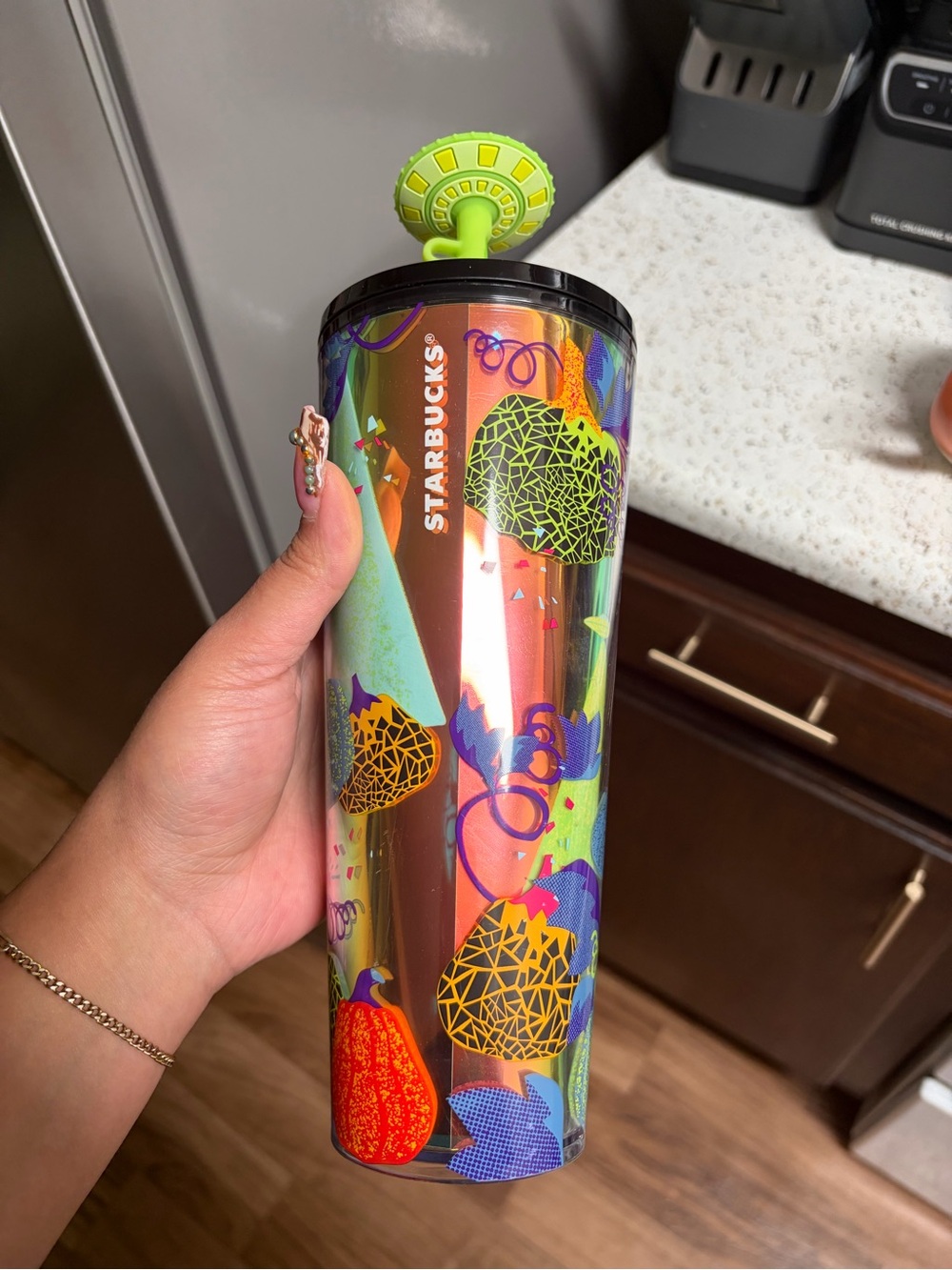 Starbucks Iridescent Tumbler with Neon Green Lid and Multi-Color Fruit Motifs